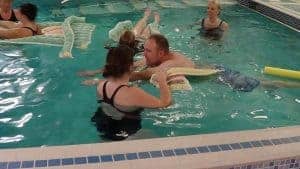 Image of the Floatsation Aids being used in the pool by an adult